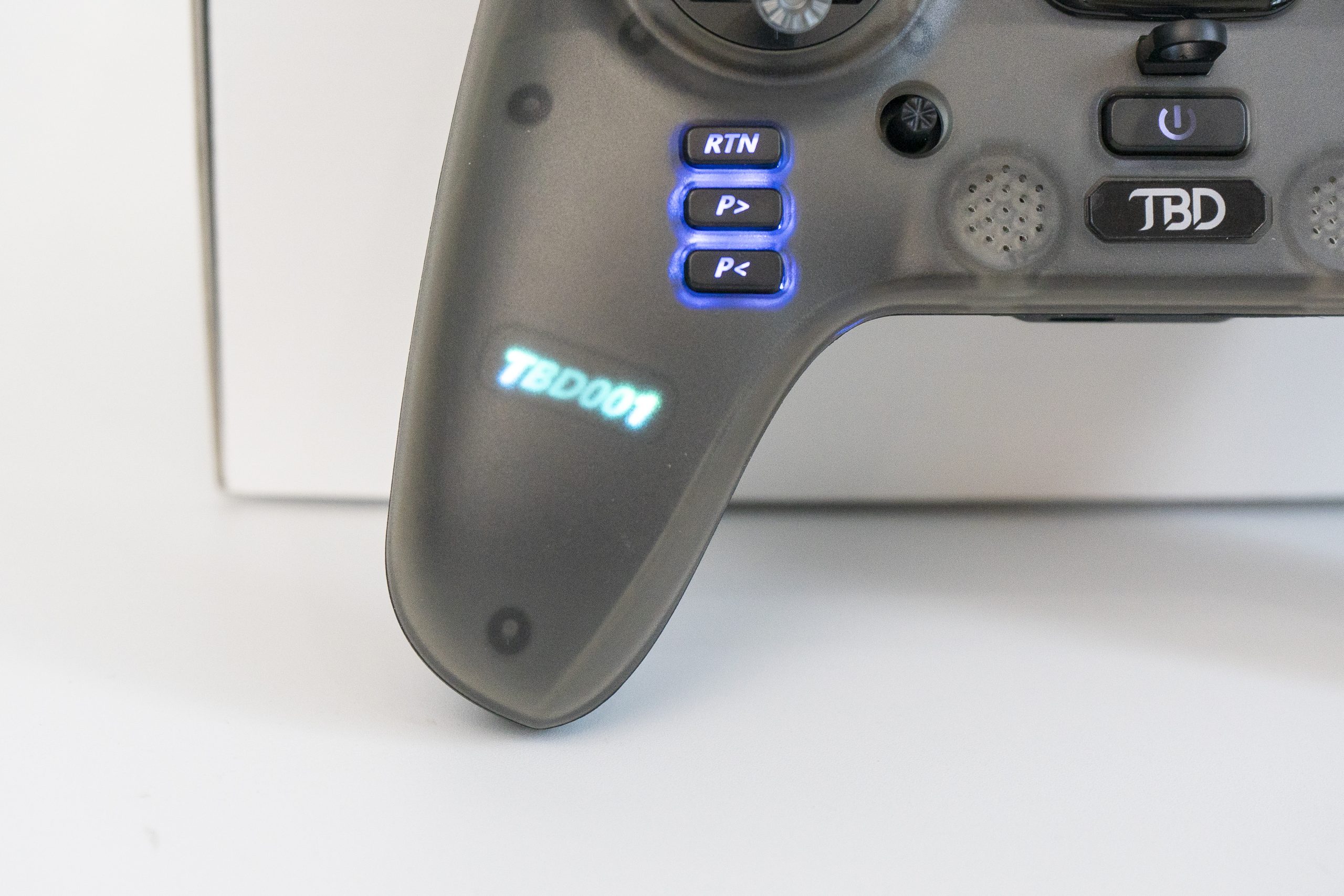 Illuminated left grip and return buttons